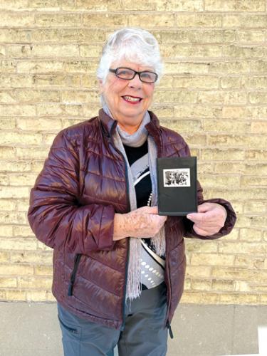 Bonnie Sitter holding old Farmerettes Photo
